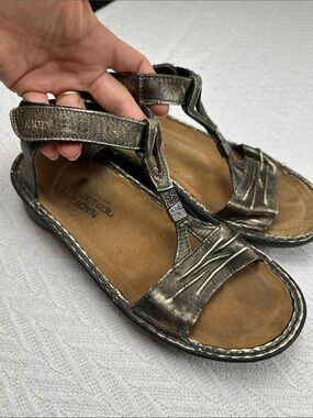 Naot Metallic Bronze Leather T-Strap Sandals